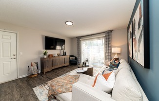 Spacious living room with hardwood-style flooring