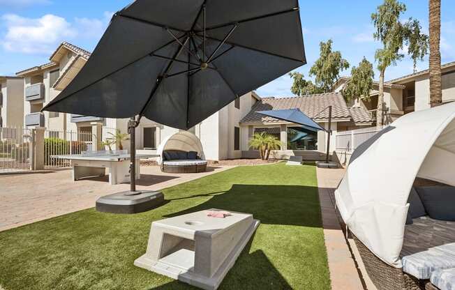 Poolside games including cornhole and ping pong