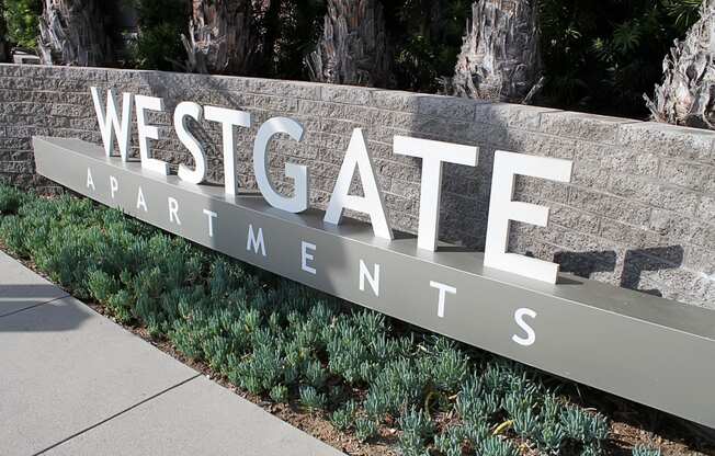 a sign at the entrance to westgate apartments