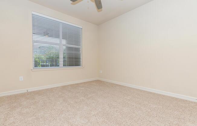 a bedroom with a large window