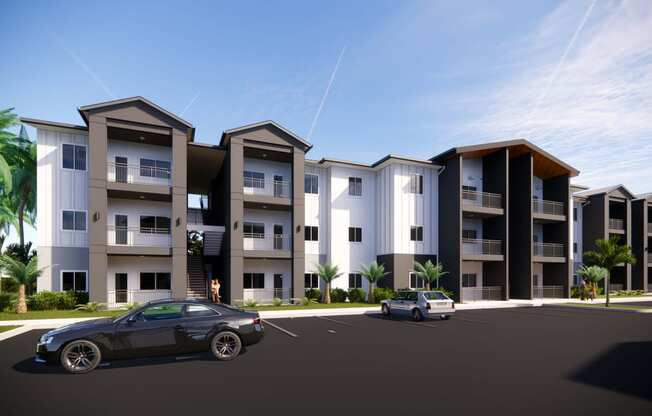 a rendering of an apartment complex with cars parked in front of it at Gibson Oaks, Lakeland, FL, 33809