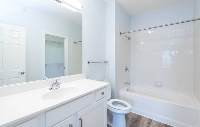 Drum Hill 2 Bedroom Apartment bathroom with bright white finishes.