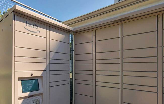 A small Amazon box is on the side of a building.