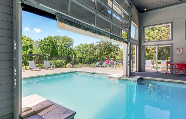 Indoor & Outdoor Pool With Glass Garage Door