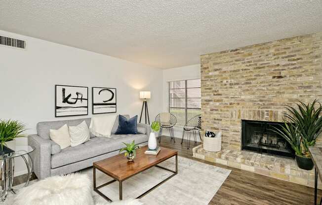 a living room with a couch and a fireplace