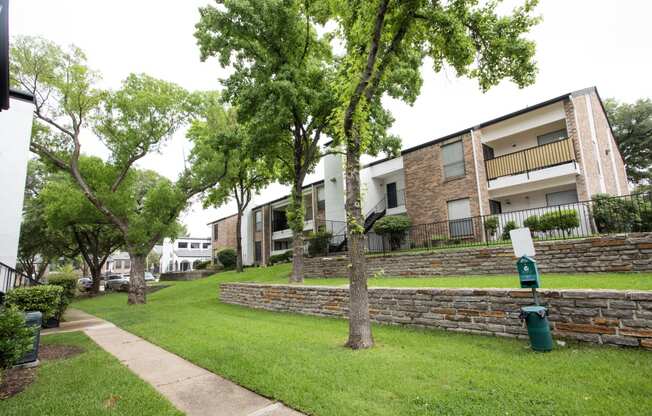 our apartments offer a green lawn and trees for residents to enjoy
