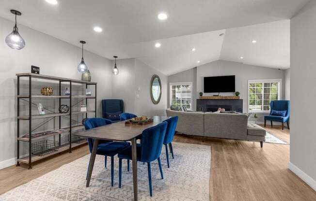 a living room with a table and chairs