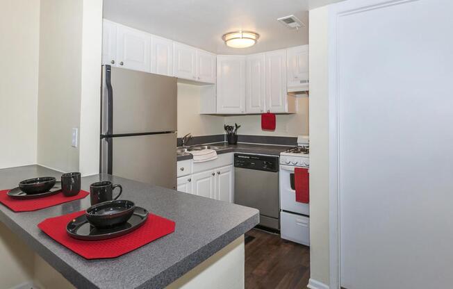 a kitchen with a sink and a refrigerator