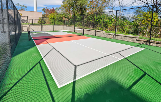 the tennis court is equipped with nets and is wheelchair accessible