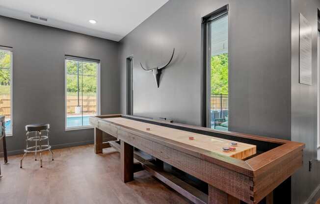 Tabletop shuffle board in our Game Room at The Lodge luxury apartments in Rochester MN