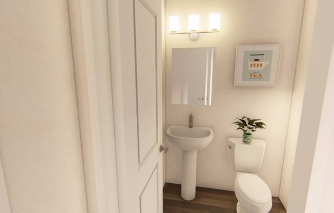 a small bathroom with a toilet sink and mirror at Brownstones at Palisade Park Townhomes, Broomfield