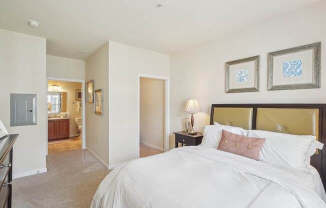 A bedroom with a large bed and a television.