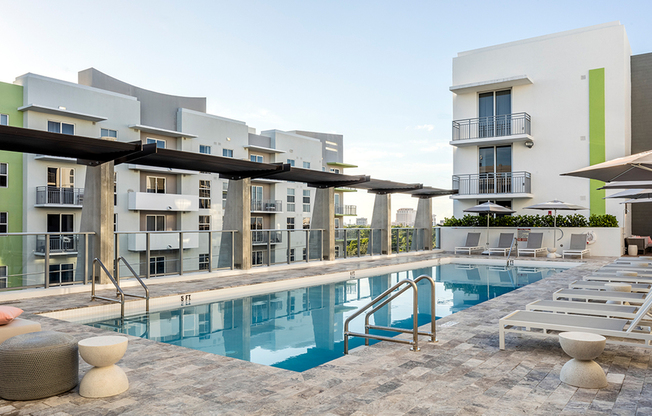 Rooftop, hotel-inspired pool with chaise loungers