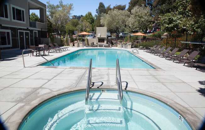A swimming pool with a ladder in the middle of it.