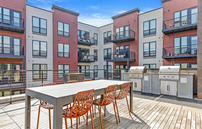 A table with chairs is on a balcony.