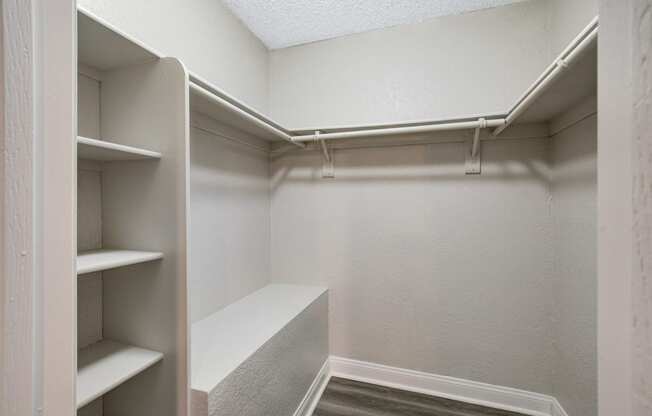 a walk in closet at the oxford at estonia apartments in san antonio,