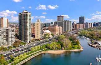 A cityscape with a river running through it.