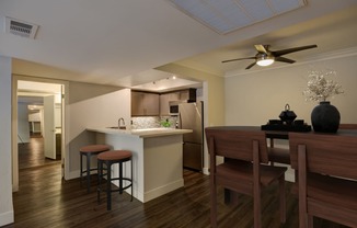 a kitchen and dining room with a table and chairs