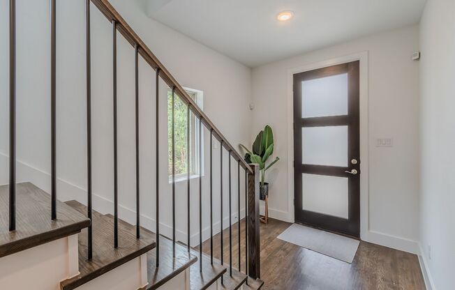 This beautifully designed 3 story home offers two private bedrooms and bath on the first floor.