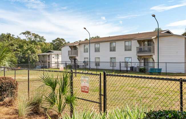 leash-free pet park and building exteriorat 701 South Apartments in Mobile, AL