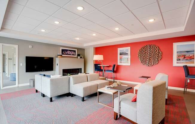 Community room with seating, tv and fireplace at Lake Jonathan Flats, Chaska, 55318