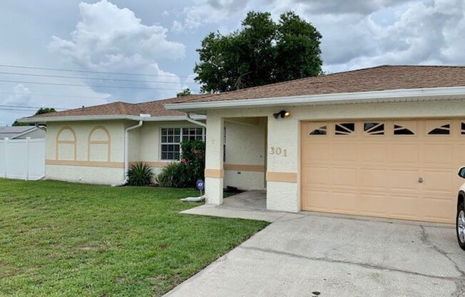 Lovely 3/2 in Poinciana! HUGE fenced yard and NO CARPET!