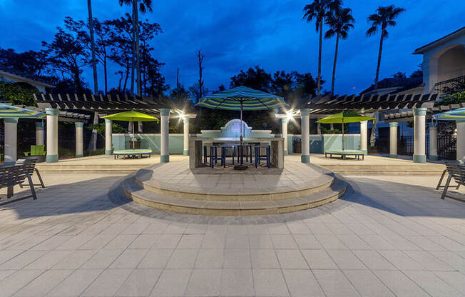 Community Patio Area with Lounge Furniture at Vinings at Hunter's Green Apartments in Tampa, FL.