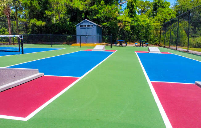 the tennis courts are painted with different colors