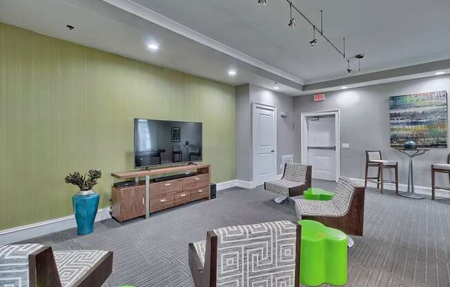 a living room with couches and chairs and a television at Nexus at Sandhill, Columbia, SC