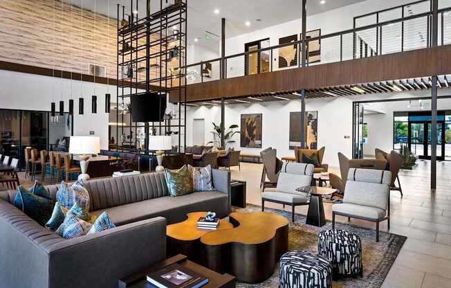 A modern living room with a grey sofa and a wooden coffee table.
