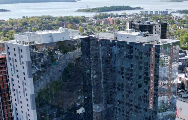 an aerial view of a tall building in the city