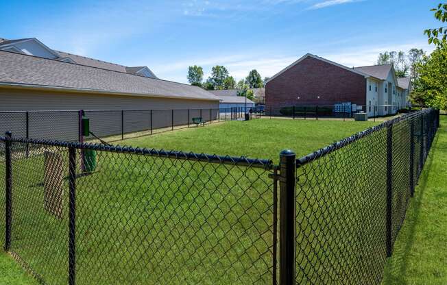 a chain link fence in front of a house