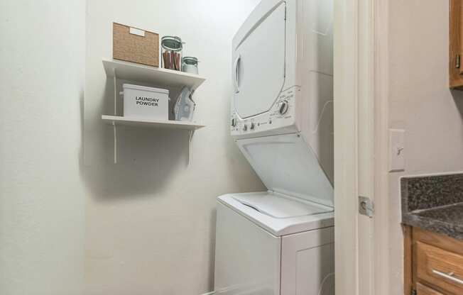the washer and dryer in the laundry room of a small home at Sanger Place, Lorton, 22079