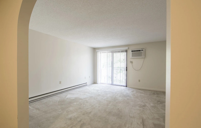 Spacious living area with sliding doors to balcony | Princeton Place | Apartments For Rent Near Worcester MA