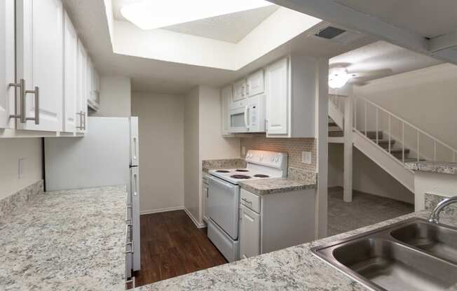 This is a photo of the kitchen in a 717 square foot 1 bedroom, 1 bath apartment at Canyon Creek Apartments in Dallas, TX