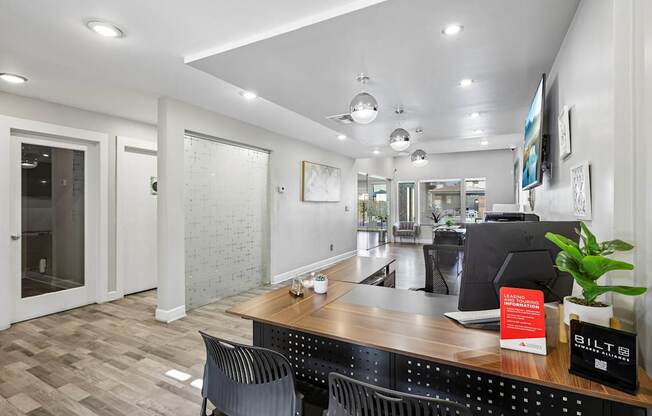 A reception area with a desk and chairs.
