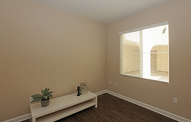 a bedroom with a large mirror next to a window