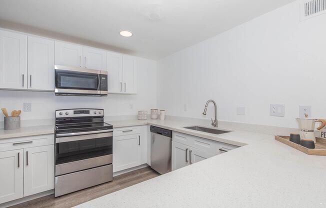a kitchen with a stove and a sink