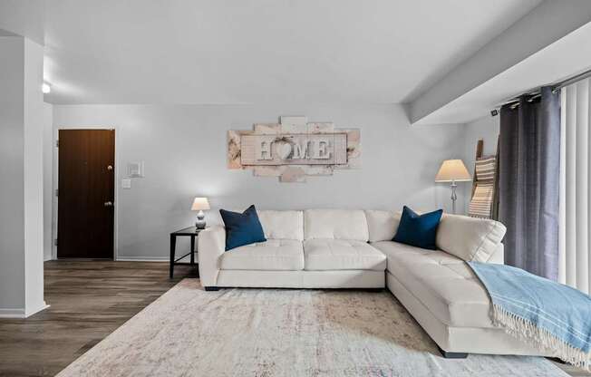 Spacious living room with natural light at Westwood Village Apartments in Westland, MI