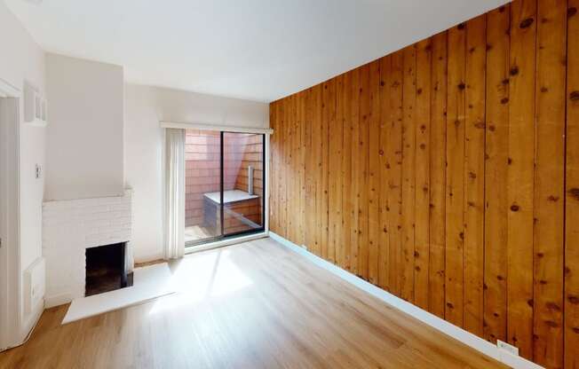 a living room with a wooden wall and a fireplace