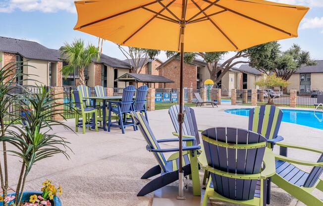 a lawn chair under an umbrella