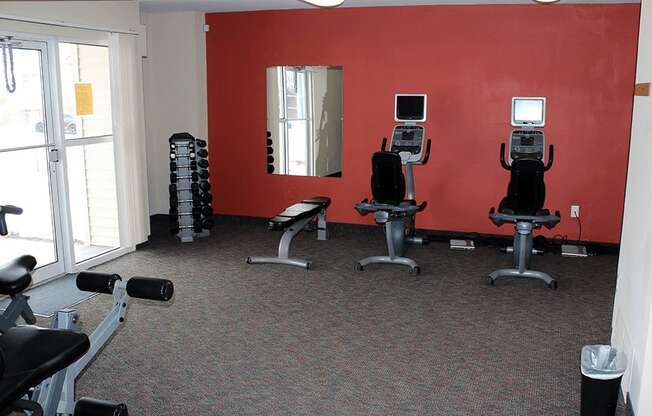 private fitness center at Sun Valley apartments with gym equipment.