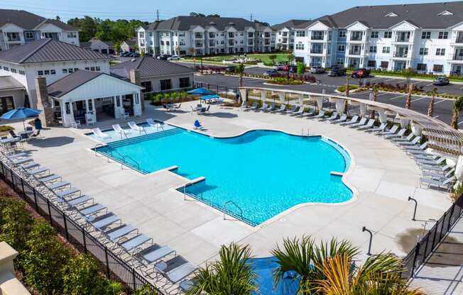an aerial view of a swimming pool at an apartment complex