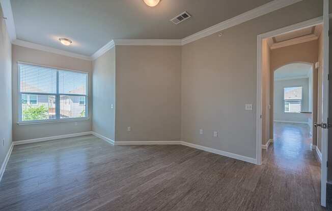 Bedroom area with a nook and hardwood flooring