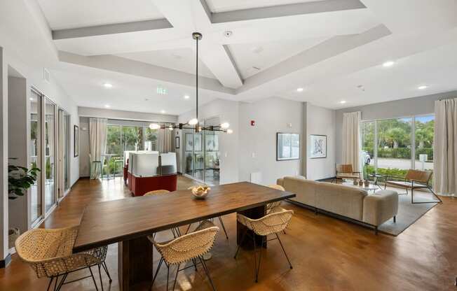 a living room with a dining room table and a couch