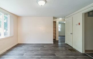 Living room with lots of lighting at Sutterfield Apartments in Providence RI