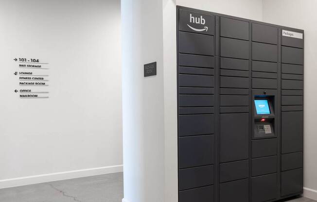 A tall black locker with a small screen on the front at Skylar At Sunset Apartments, California