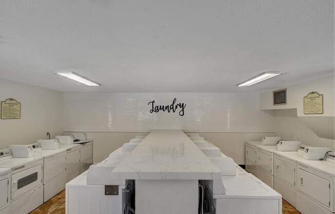 Laundry room with washers and dryers.