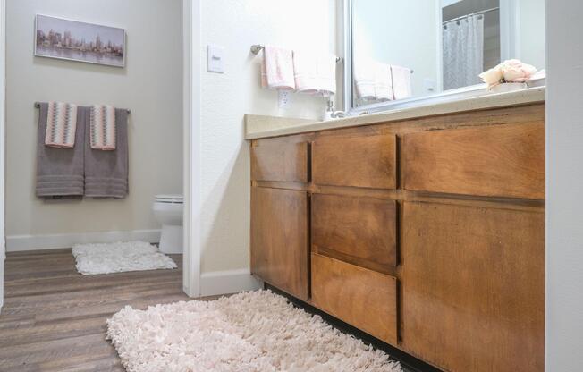 a kitchen with a sink and a mirror