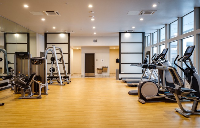 a gym with treadmills and other exercise equipment